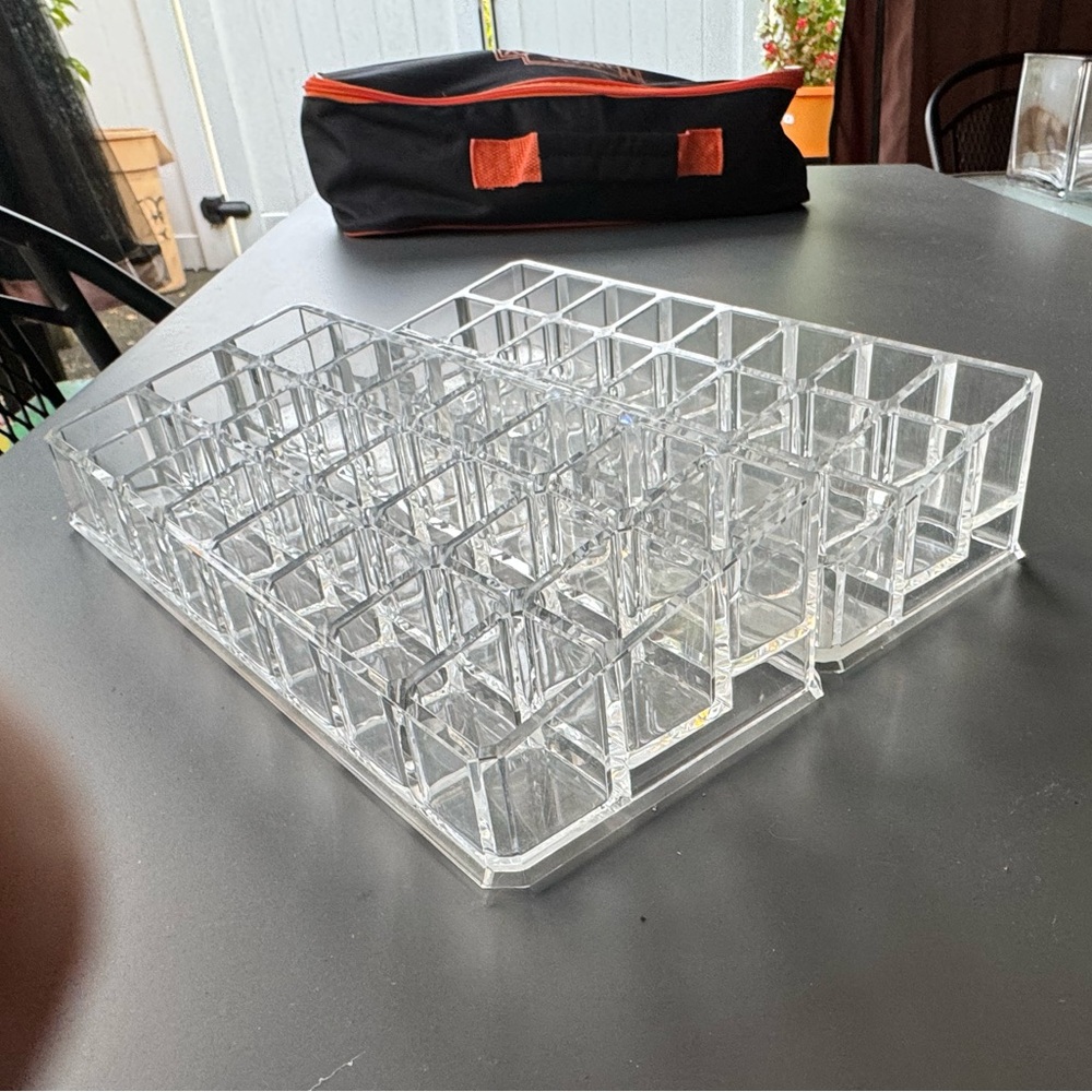 Set of three lipstick stands